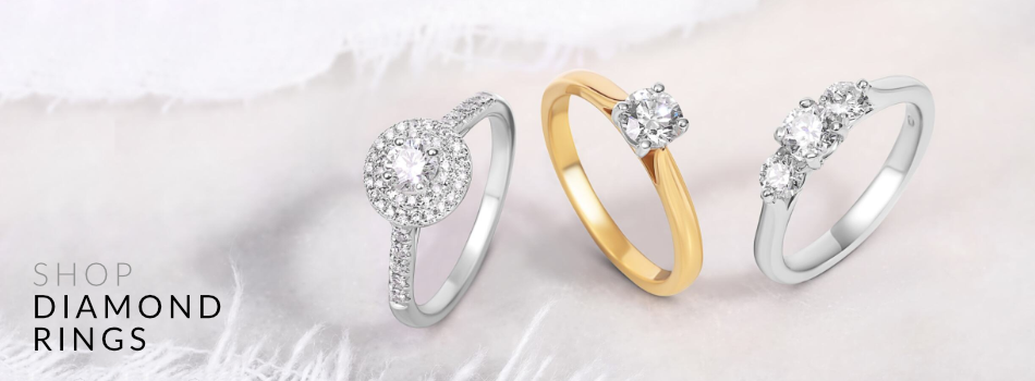 An assortment of stunning diamond rings beautifully displayed to highlight their brilliance.